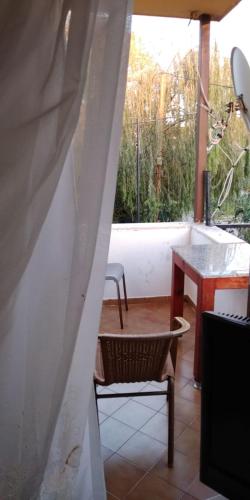a room with a table and a chair and a table and a window at Ala Otel Konuk Evi Agva in Sile