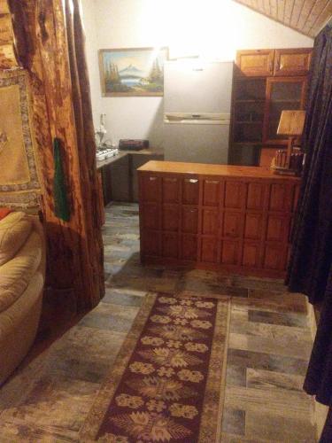 a kitchen with a couch and a refrigerator in a room at Ala Otel Konuk Evi Agva in Sile