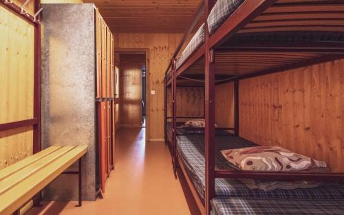 a hallway with two bunk beds in a room at RinerLodge in Davos