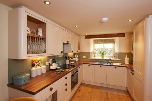 Kuchyň nebo kuchyňský kout v ubytování Spring Cottage