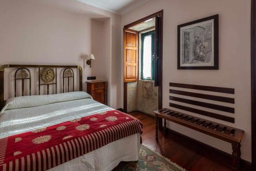 Postel nebo postele na pokoji v ubytování Hotel - Casa de Turismo Rural Dugium