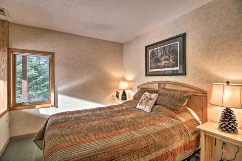 a bedroom with a large bed and a window at Lutsen Mountain Townhome - 2 Mi to Lake Superior! in Lutsen