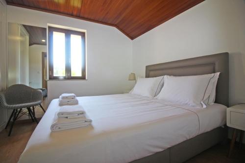 Postel nebo postele na pokoji v ubytování Casa da Terrada