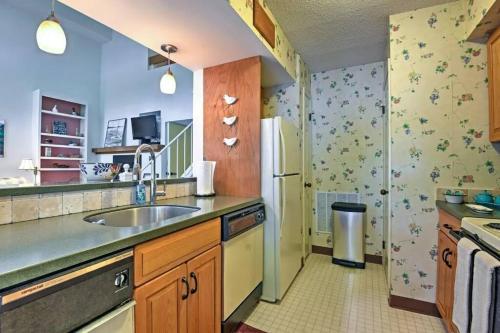 a kitchen with a sink and a refrigerator at LAKEFRONT Penthouse at Jack Frost Big Boulder in Lake Harmony