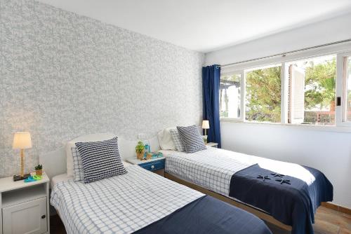 Ένα ή περισσότερα κρεβάτια σε δωμάτιο στο Casa Maspalomas