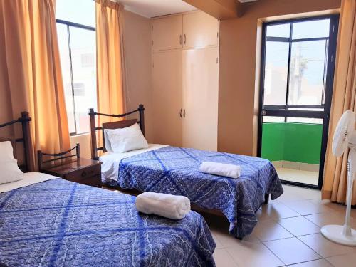 Postel nebo postele na pokoji v ubytování Sol de Paracas Apart Hotel