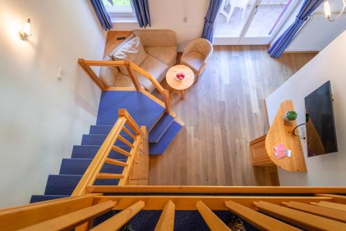 an overhead view of a living room and staircase in a house at Gartenheim Tramin in Termeno