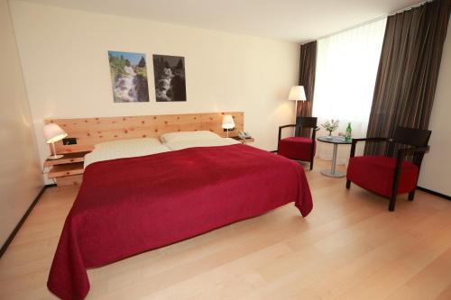 Ein Bett oder Betten in einem Zimmer der Unterkunft Hotel Albula & Julier