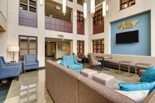 a lobby of a hospital with chairs and a tv at Best Western Plus Indianapolis North at Pyramids in Indianapolis