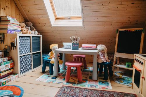 a toy room with a table and two teddy bears at Domek Sienna 1a Czarna Góra in Stronie Śląskie