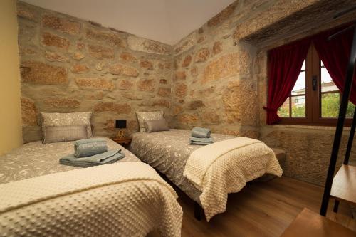 Katil atau katil-katil dalam bilik di Casa do Parente