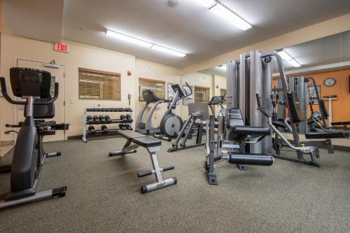 a gym with several treadmills and exercise machines at Candlewood Suites Houston Medical Center by IHG in Houston