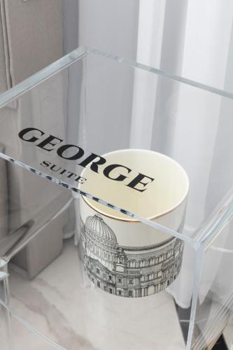 a glass shelf with a bowl in a refrigerator at King George suites in Jerusalem