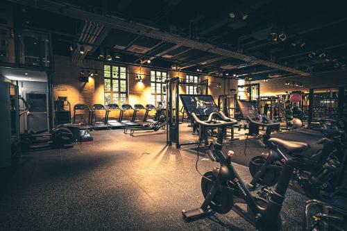 a gym with a bunch of chairs and machines at Easthampstead Park in Bracknell