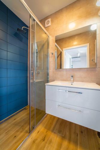 a bathroom with a sink and a shower at Amber Resort in Rewal