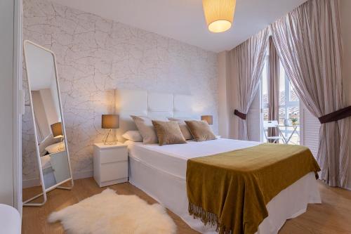 Posteľ alebo postele v izbe v ubytovaní Exclusive Apartments Plaza Merced