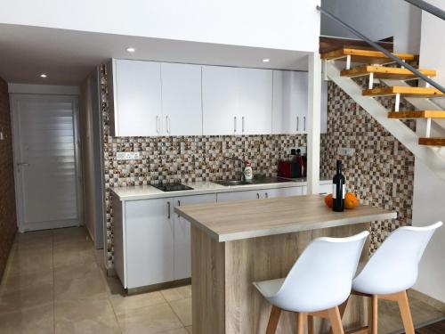 Kuchyň nebo kuchyňský kout v ubytování Cozy Loft Apartment 2