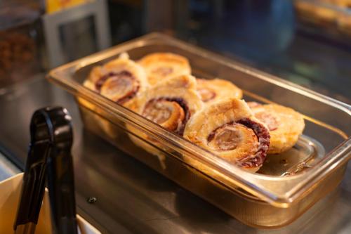 a tray of pastries sitting on a counter at Bayview Hotel in Courtenay