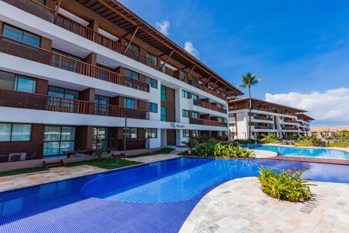 an image of an apartment building with a swimming pool at Cupe Beach Living Beira Mar - Flat 02 quartos in Porto De Galinhas