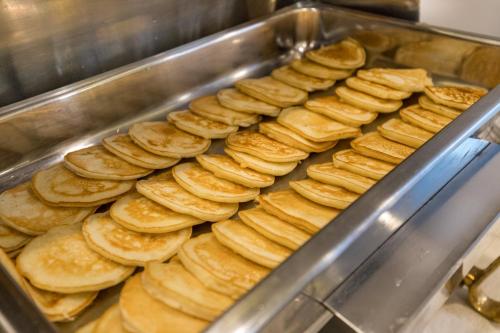 a bunch of breads are being prepared in a machine at Landmark Pokhara in Pokhara