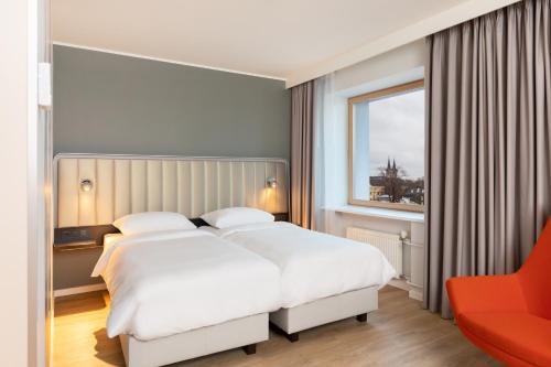 Postel nebo postele na pokoji v ubytování Park Inn by Radisson Meriton Conference & Spa Hotel Tallinn