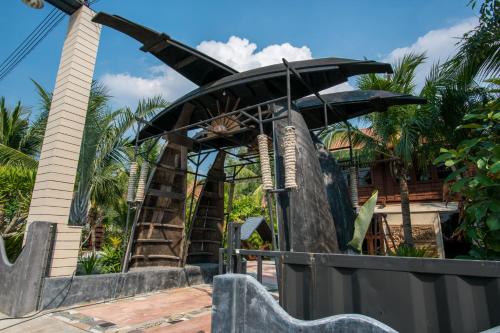 a playground in front of a resort with a pirate ship at Suankaew​ art​ hostel​ in Chon Buri