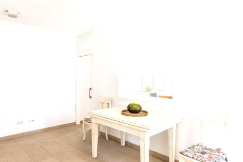 a white table in a kitchen with a bowl on it at Seaside Villa in Cap d'en Font with Private Pool in Cap d'en Font