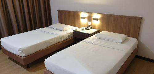 Postel nebo postele na pokoji v ubytování Hotel Samila