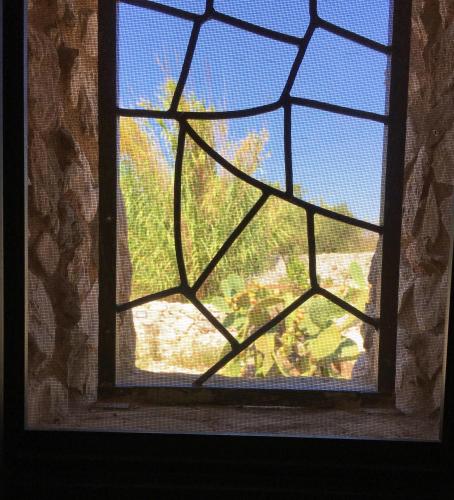 a glass window with a view of a mountain at Charming Apartment with Jacuzzi and Sea View - Salve, 85 sqm in Salve