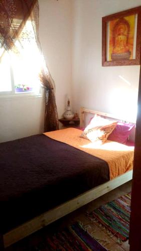 a bedroom with a bed and a window at Cozy House Mountain View Algodonales in Algodonales