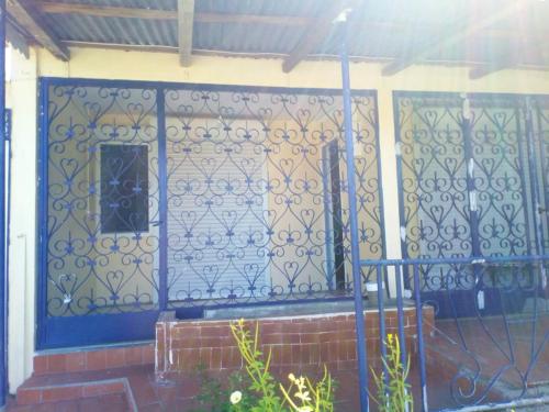 a front door of a house with a blue at Maison de 2 chambres avec jardin clos a Basse Terre in Basse-Terre
