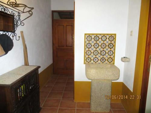 a room with a wall with a counter and a door at Charming Villa near Anta with Private Pool in Anta