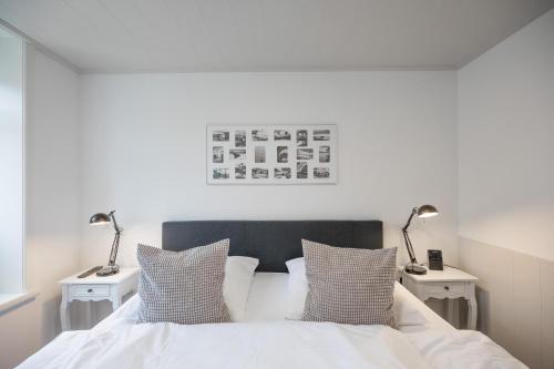 מיטה או מיטות בחדר ב-Apartmenthaus Theodor Storm Meeresstrand