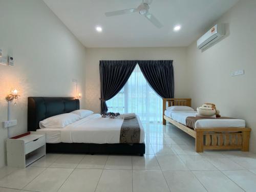 Tempat tidur dalam kamar di Langkawi Cozy Holiday Home at Desa Impian by Zervin