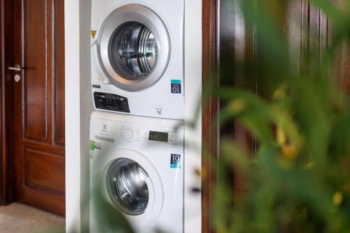two washing machines sitting next to each other at Pegasy Premium Suites & Residence Westlake in Hanoi
