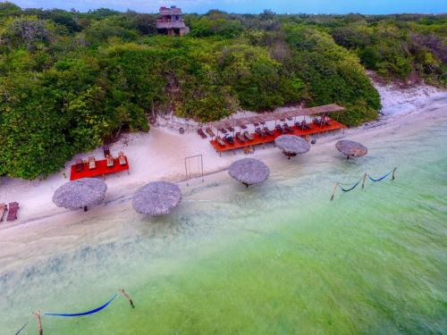 an aerial view of a beach with tables and umbrellas at Casa B&B in Jijoca de Jericoacoara