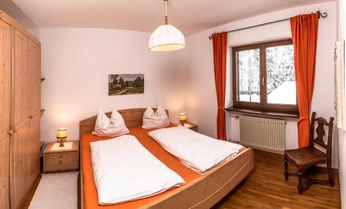 Un pat sau paturi într-o cameră la Residence Lärchenhäusl