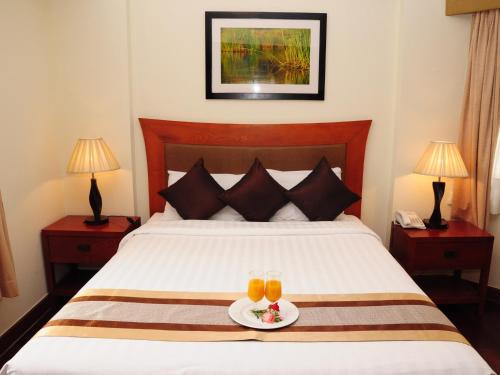 מיטה או מיטות בחדר ב-Riverside Serviced Apartments