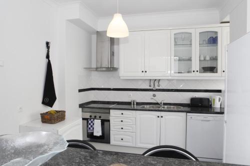 Η κουζίνα ή μικρή κουζίνα στο Comfortable and Central Apartment Cascais