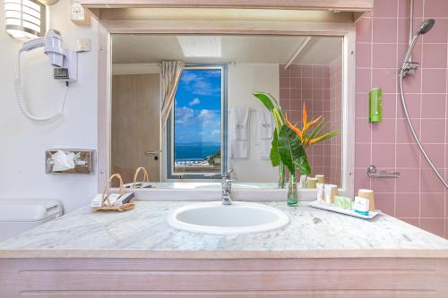 Een badkamer bij Karibea Squash Hotel