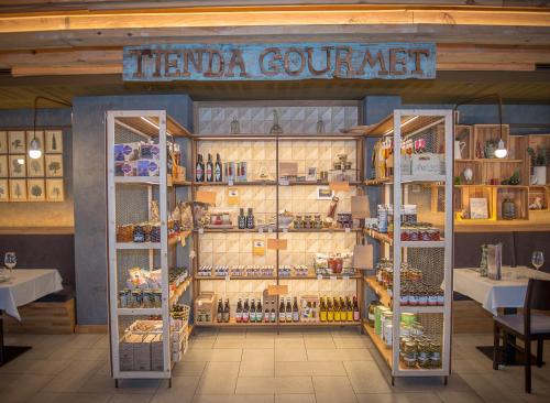 a store with a display of food and drinks at Apartahotel & Spa Jacetania in Jaca