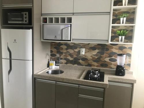 Η κουζίνα ή μικρή κουζίνα στο Apartamento Frente ao Mar Santos