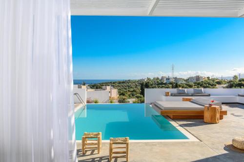 a view of a pool from a house at Cocoon Luxury Villas in Hersonissos