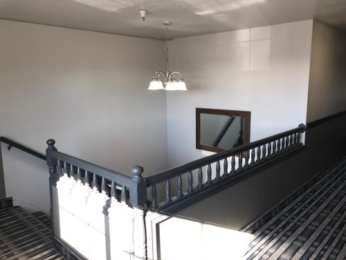 a staircase in a building with a mirror on the wall at Ameri-Stay Inn & Suites in Clearfield