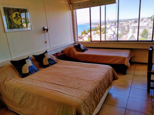 Una cama o camas en una habitación de Apartamento Bariloche Center