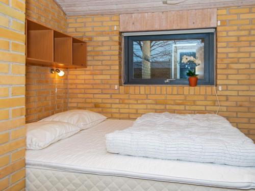 Ein Bett oder Betten in einem Zimmer der Unterkunft Holiday home Ørsted XVII