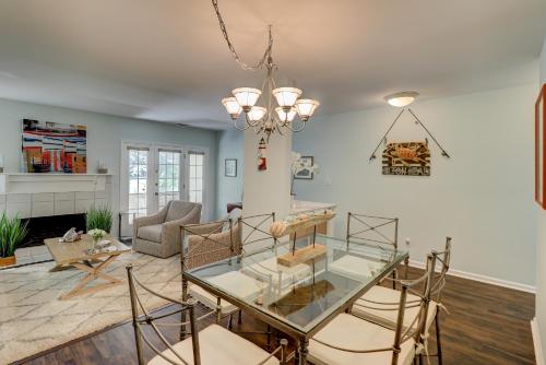 a living room with a glass table and chairs at 110 Evian 2 BR Shipyard in Hilton Head Island