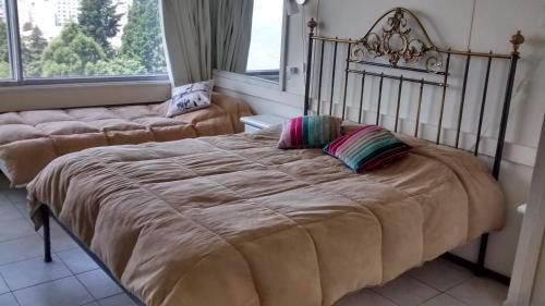 Cama o camas de una habitación en Apartamento Bariloche Center
