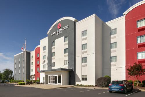 a car parked in front of a hotel at Candlewood Suites Fayetteville Fort Bragg by IHG in Fayetteville