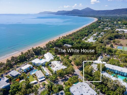 an aerial view of the white house and the beach at The White House Port Douglas in Port Douglas